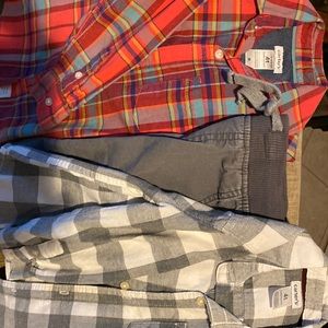 3 pc. Carters set. 2 Long sleeve shirts with grey pants.All like new.